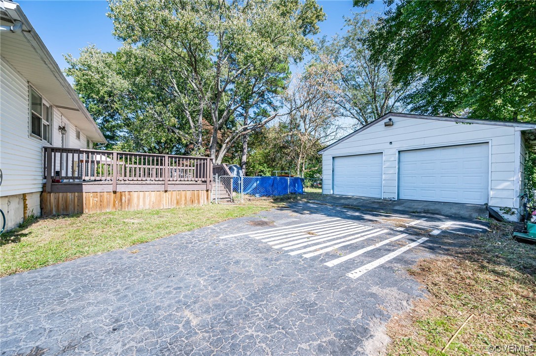 16001 Meridian Avenue Chester, VA 23831 - Photo 20 of 26 a house with a yard and garage