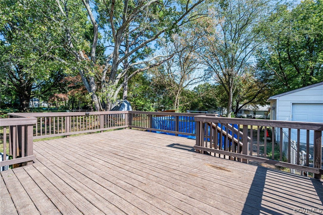 16001 Meridian Avenue Chester, VA 23831 - Photo 22 of 26 a view of deck with wooden floor and fence