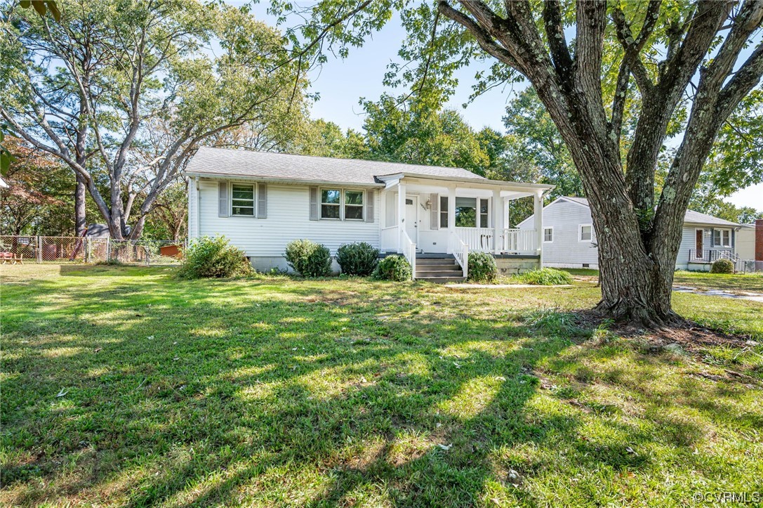 16001 Meridian Avenue Chester, VA 23831 - Photo 3 of 26 a front view of a house with garden