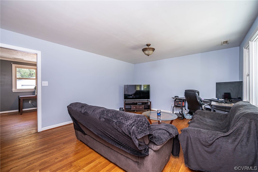 16001 Meridian Avenue Chester, VA 23831 - Photo 6 of 26 a living room with furniture and a flat screen tv