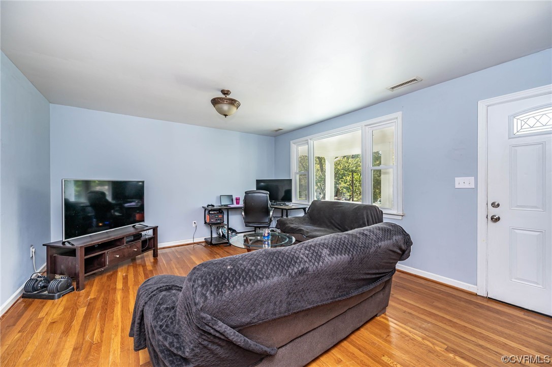 16001 Meridian Avenue Chester, VA 23831 - Photo 7 of 26 a living room with furniture and a flat screen tv