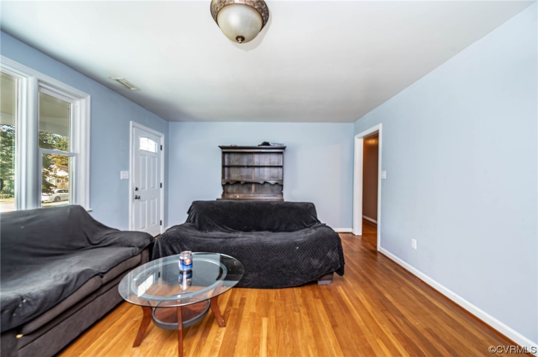 16001 Meridian Avenue Chester, VA 23831 - Photo 8 of 26 a living room with furniture and wooden floor