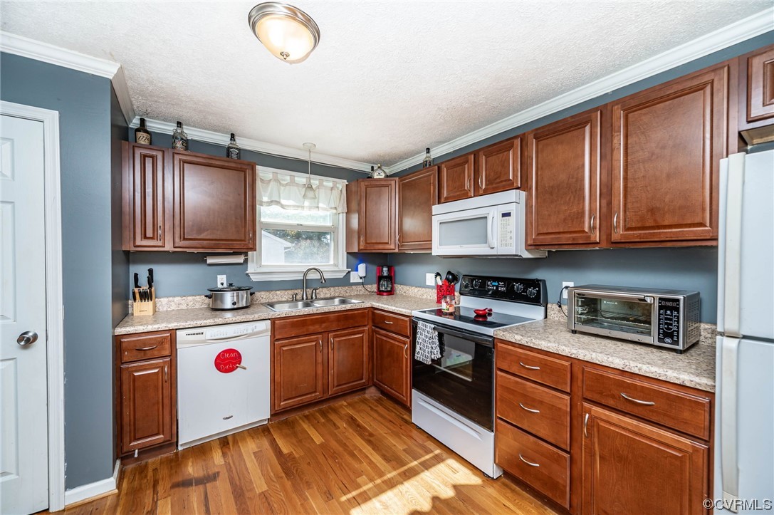 16001 Meridian Avenue Chester, VA 23831 - Photo 10 of 26 a kitchen with stainless steel appliances granite countertop a sink dishwasher stove and cabinets with wooden floor