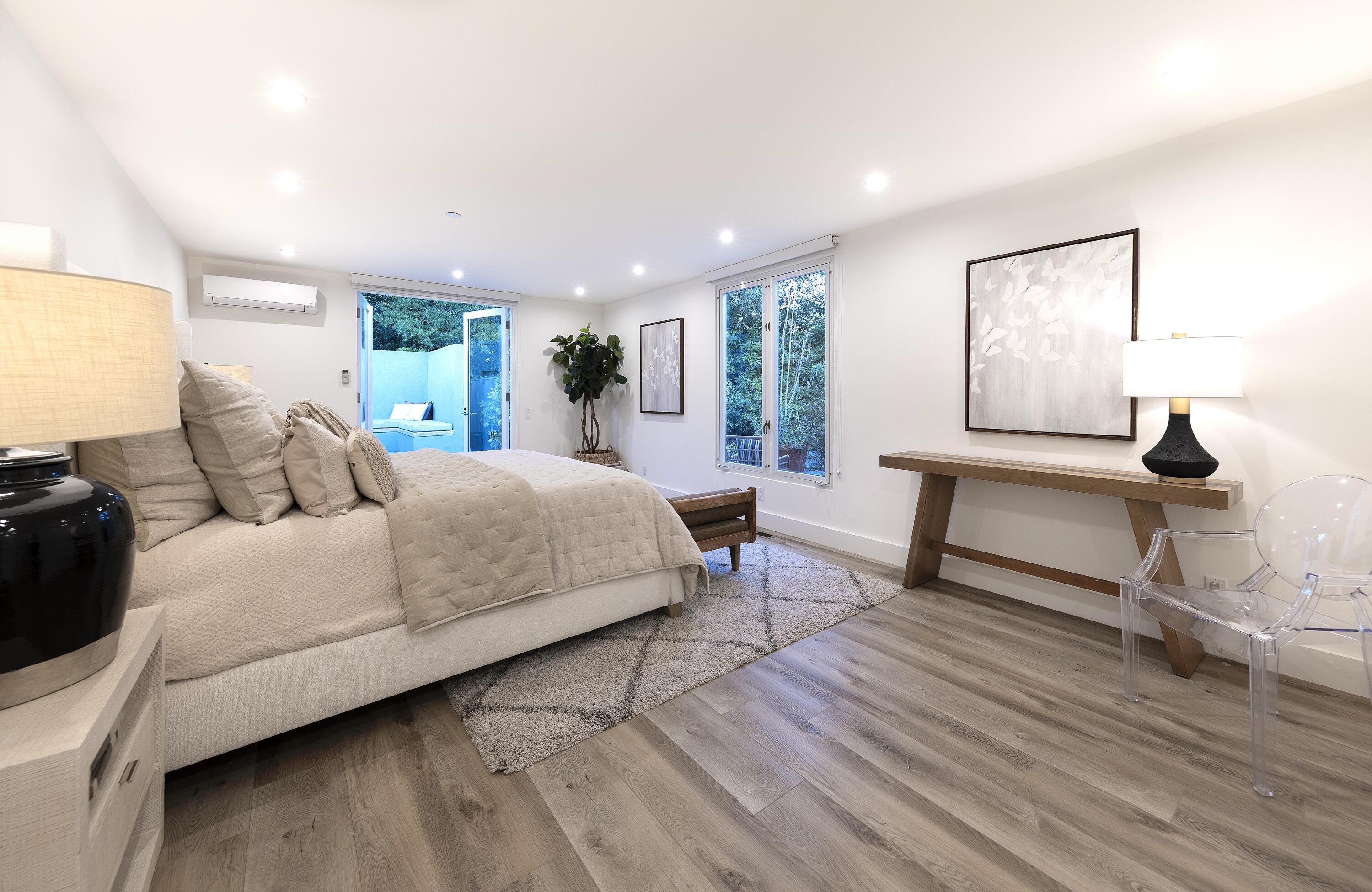 1524 East Valley Road Montecito, CA 93108 - Photo 9 of 19 a bedroom with a bed a lamp and window