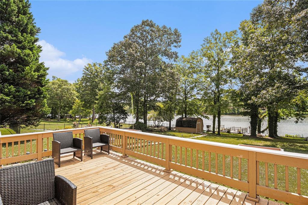 96 Pointe View Court Jackson, GA 30233 - Photo 27 of 36 a view of balcony with two chairs and a table