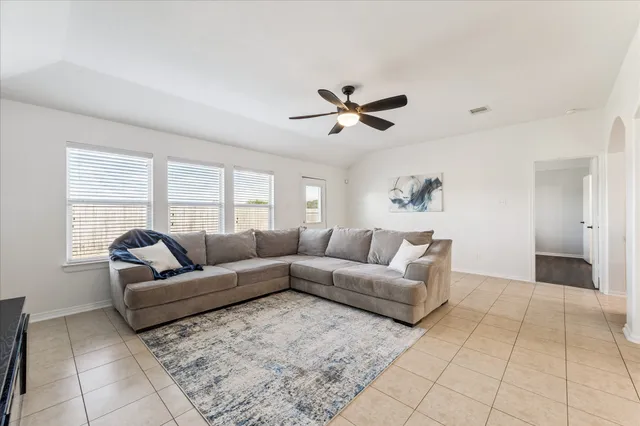 a living room with furniture and a large window