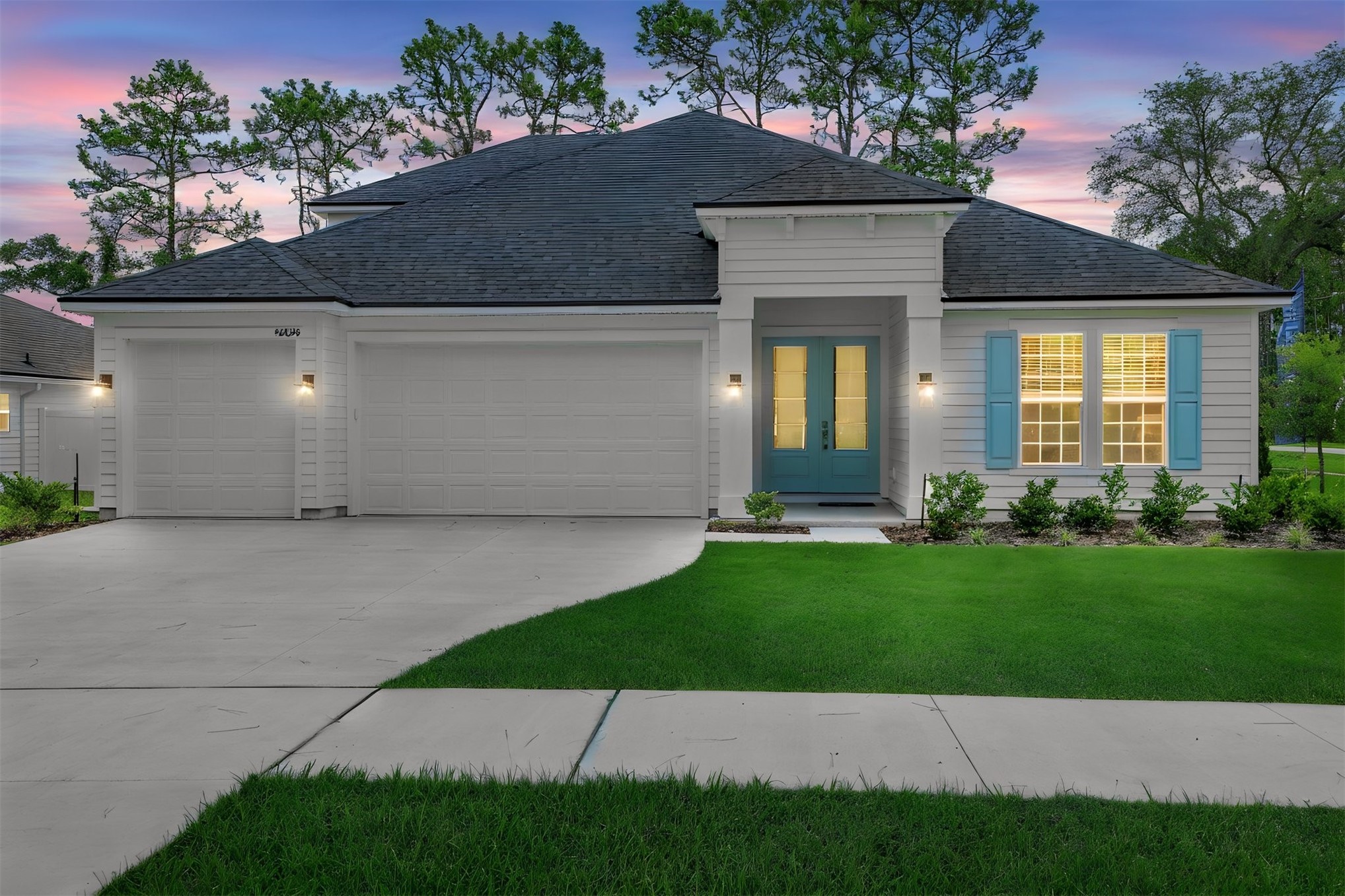 96040 Pirates Bluff Road Yulee, FL 32097 - Photo 6 of 38 a front view of a house with a yard and potted plants