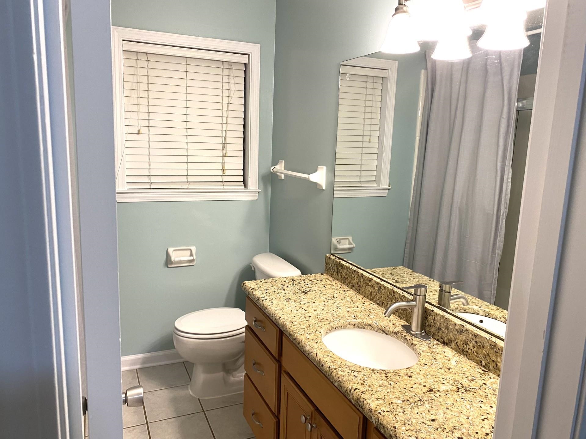 7918 Farmingdale Road Germantown, TN 38138 - Photo 10 of 12 Bathroom with tile patterned flooring, vanity, and toilet