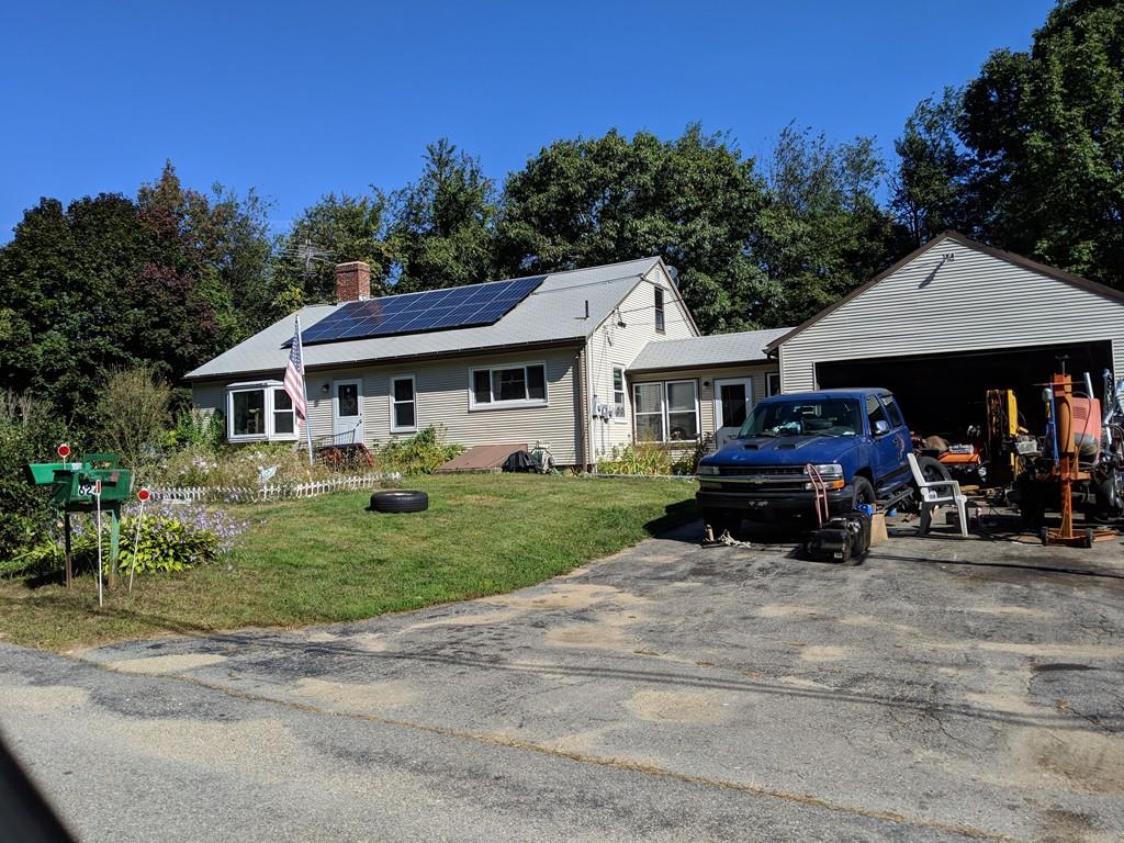 624 Richardson Road Ashby, MA 01431 - Photo 1 of 2 a car parked in front of a house