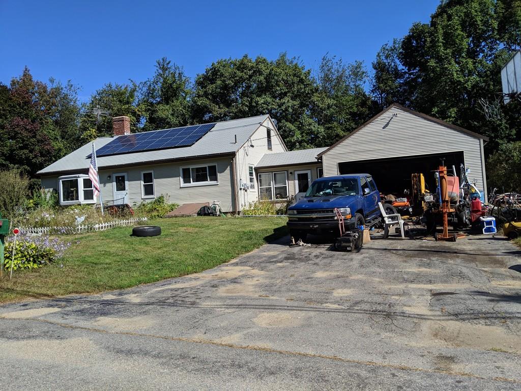 624 Richardson Road Ashby, MA 01431 - Photo 2 of 2 a front view of a house with garden