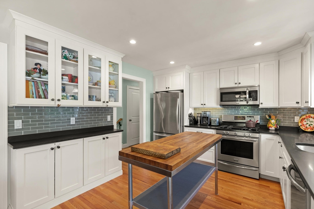 6 Ferry Road, Unit A Salisbury, MA 01952 - Photo 13 of 28 a kitchen with stainless steel appliances granite countertop a stove and a refrigerator