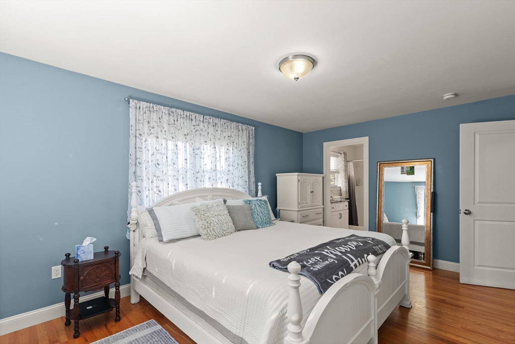 6 Ferry Road, Unit A Salisbury, MA 01952 - Photo 15 of 28 a bedroom with a bed and wooden floor