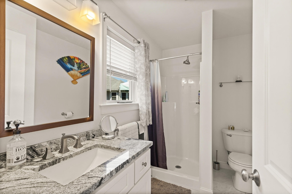 6 Ferry Road, Unit A Salisbury, MA 01952 - Photo 19 of 28 a bathroom with a granite countertop sink toilet and shower