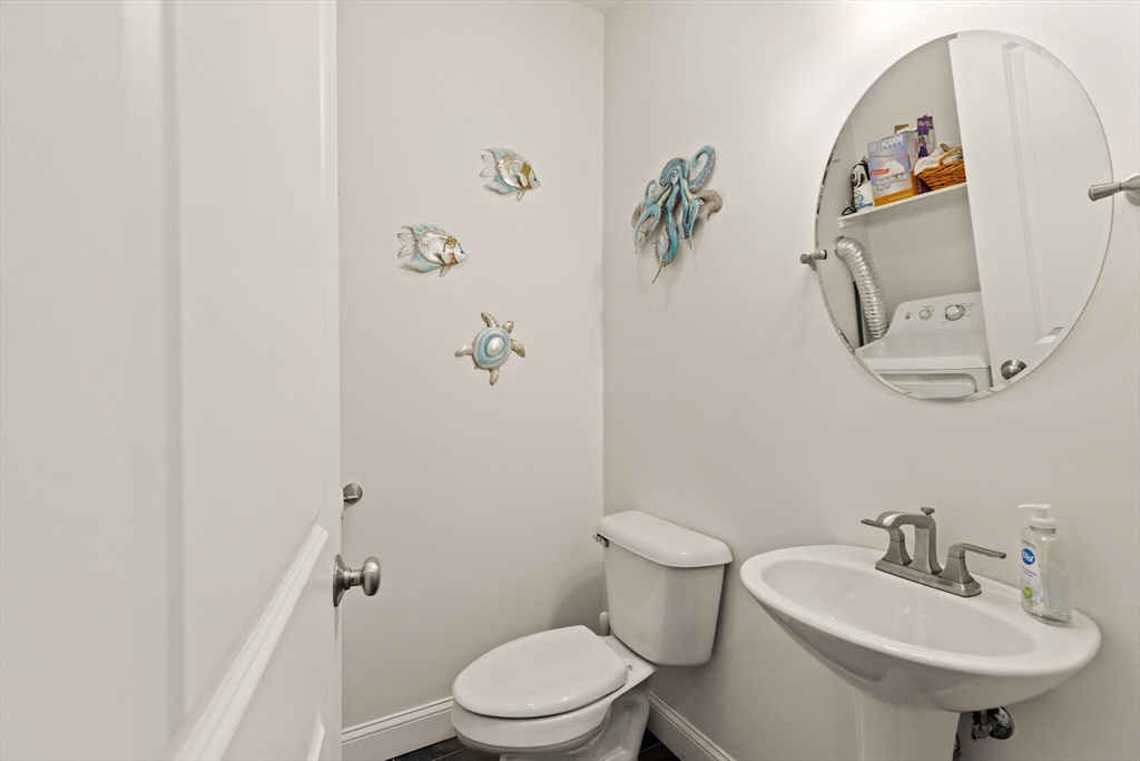 6 Ferry Road, Unit A Salisbury, MA 01952 - Photo 20 of 28 a bathroom with a toilet sink and mirror