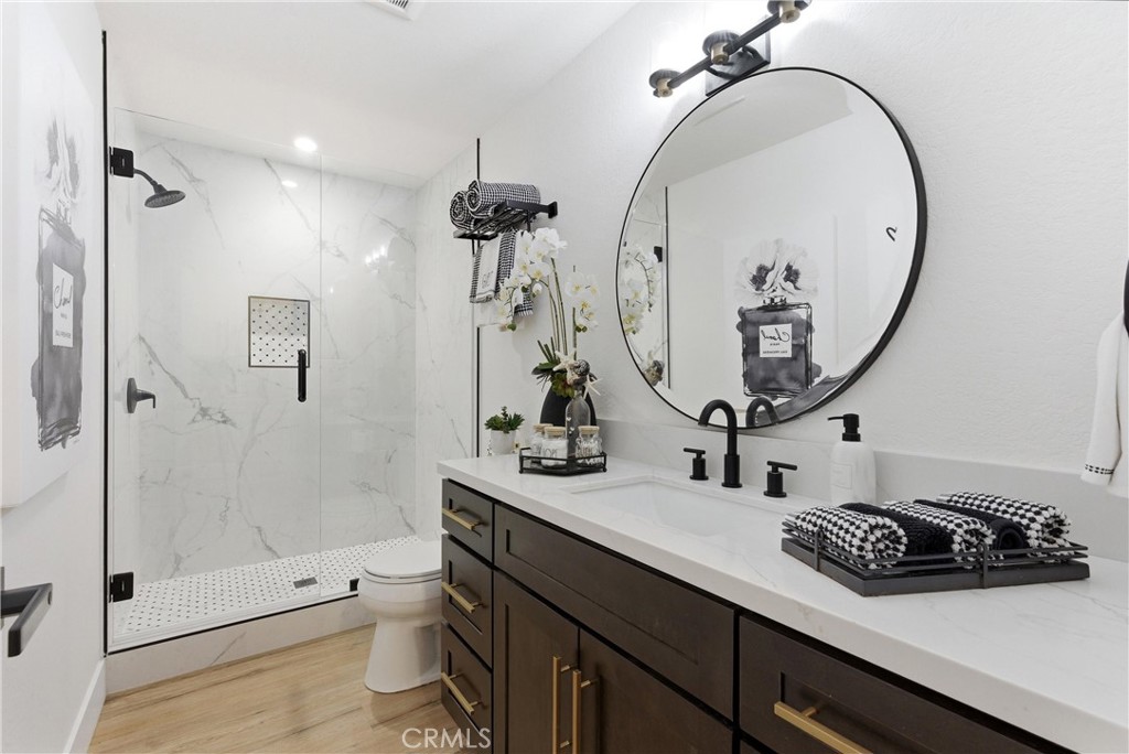 23281 Atlantis Way Dana Point, CA 92629 - Photo 45 of 81 a bathroom with a sink a toilet and shower