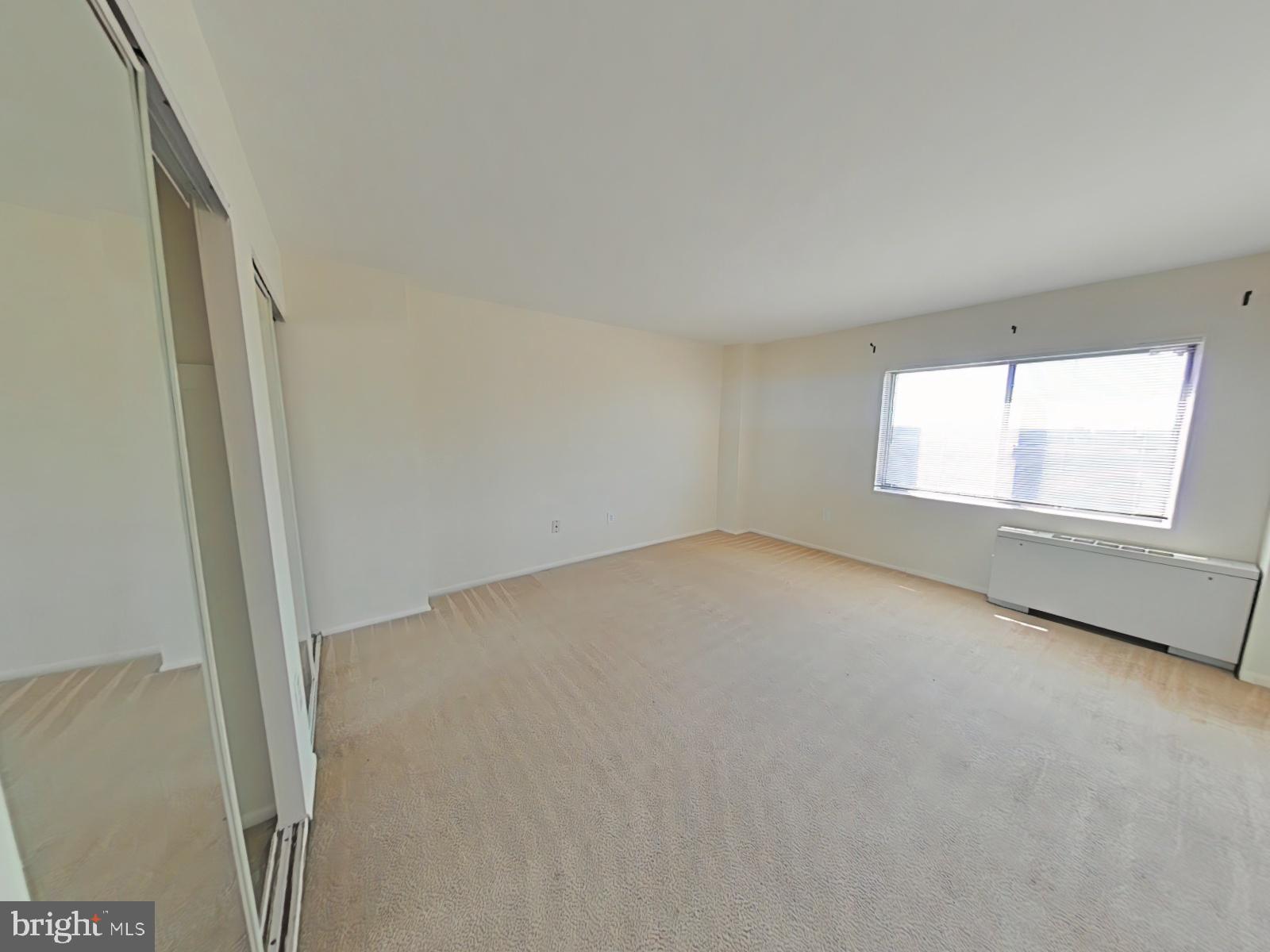 1111 University Boulevard West, Unit 1406A Silver Spring, MD 20902 - Photo 11 of 25 Primary Bedroom
