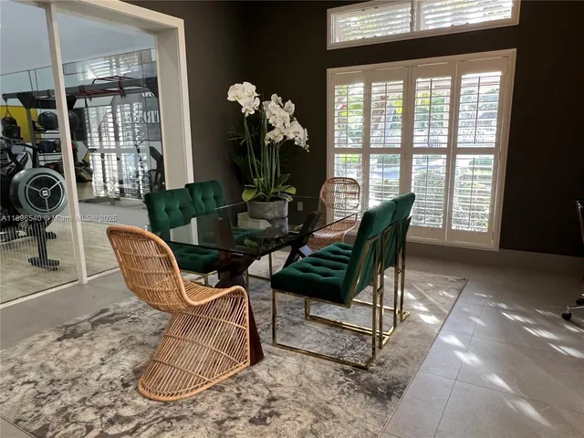 a view of a dining room with furniture window and outside view