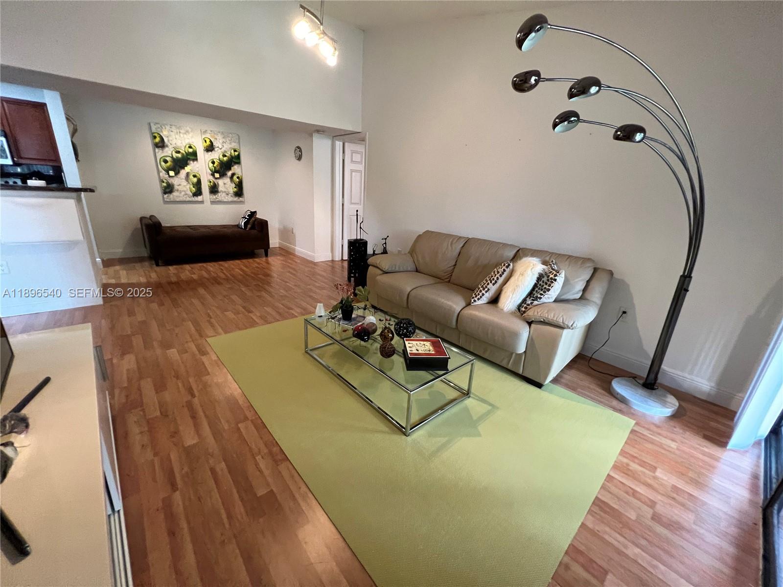 15689 Southwest 106th Lane, Unit 706 Miami, FL 33196 - Photo 4 of 23 a living room with furniture