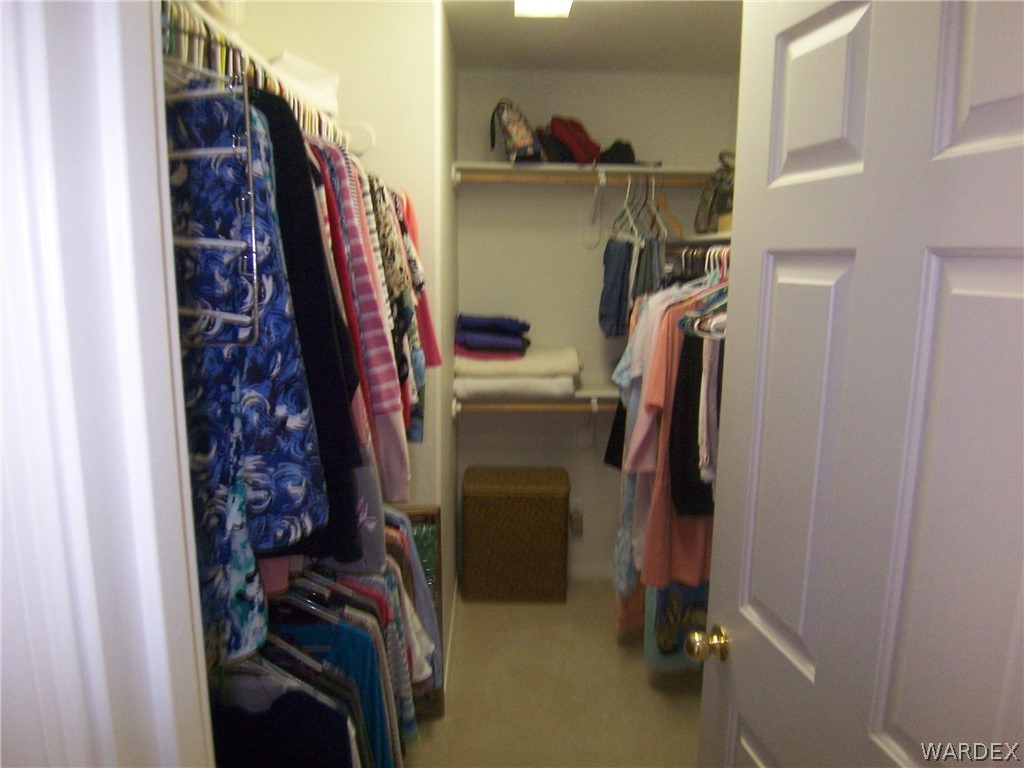 2340 Corwin Road Bullhead City, AZ 86442 - Photo 18 of 38 a view of walk in closet with clothes and shoes