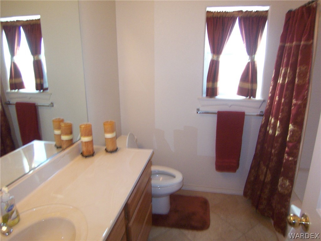 2340 Corwin Road Bullhead City, AZ 86442 - Photo 23 of 38 a bathroom with a sink and a mirror