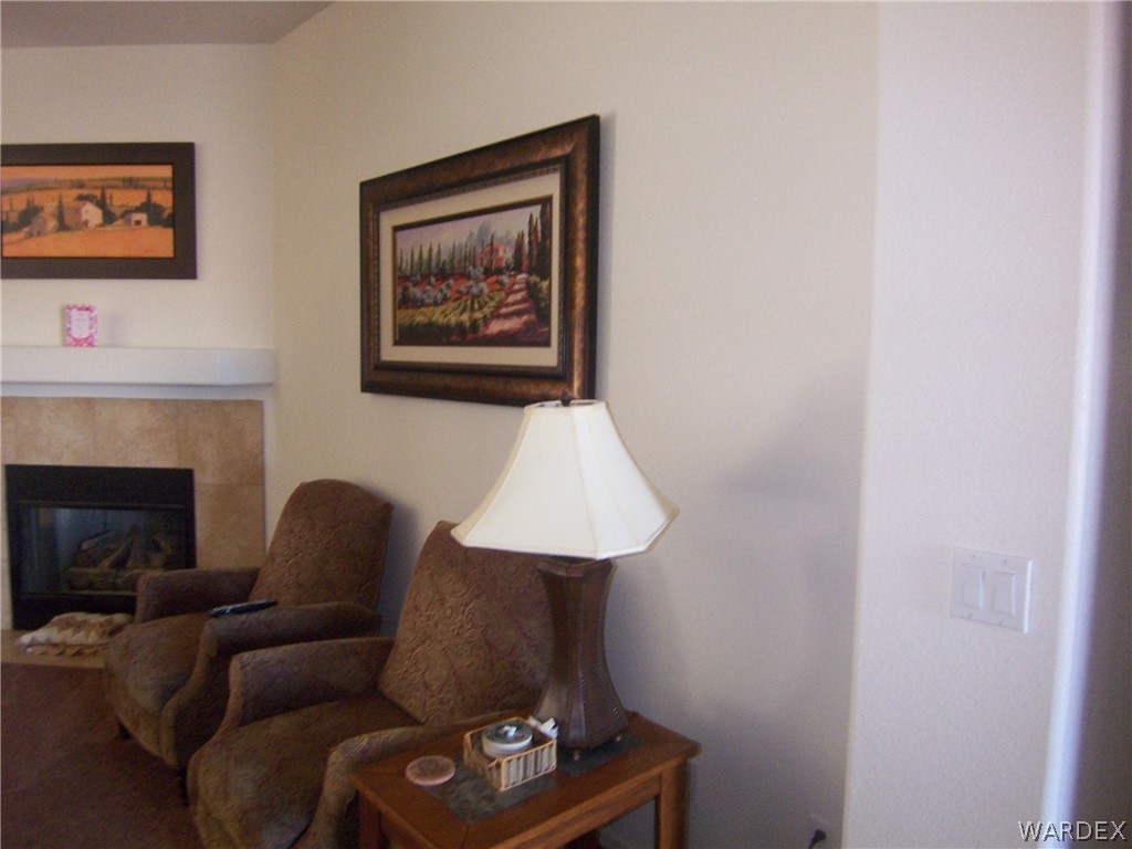 2340 Corwin Road Bullhead City, AZ 86442 - Photo 27 of 38 a living room with furniture and a fireplace