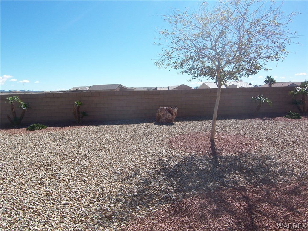 2340 Corwin Road Bullhead City, AZ 86442 - Photo 29 of 38 a view of wooden fence and a mountain view