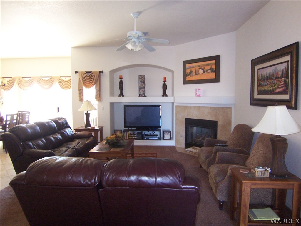 2340 Corwin Road Bullhead City, AZ 86442 - Photo 31 of 38 a living room with furniture a large window and a fireplace