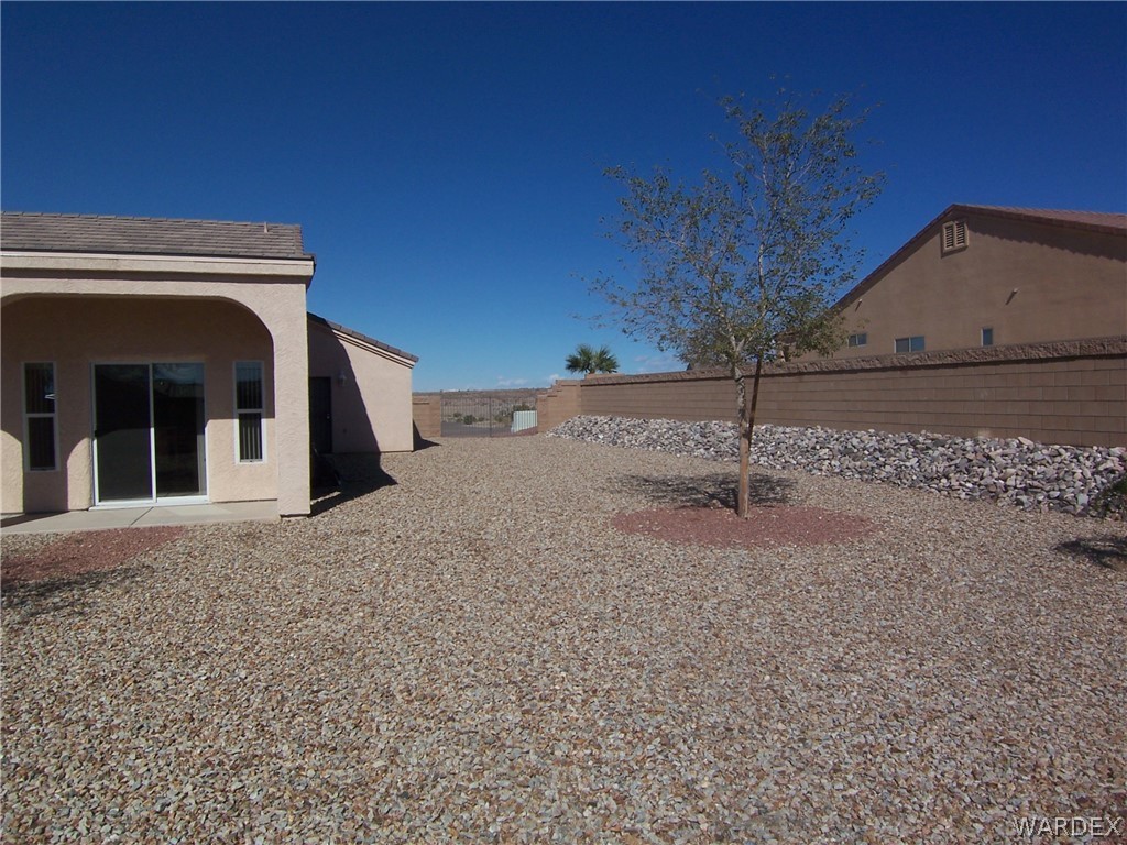 2340 Corwin Road Bullhead City, AZ 86442 - Photo 34 of 38 a view of a house with a yard