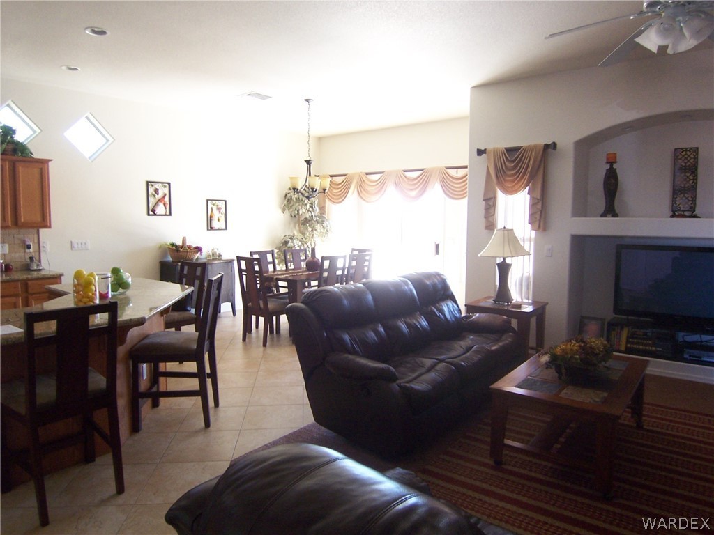 2340 Corwin Road Bullhead City, AZ 86442 - Photo 6 of 38 a living room with furniture a large window and a fireplace