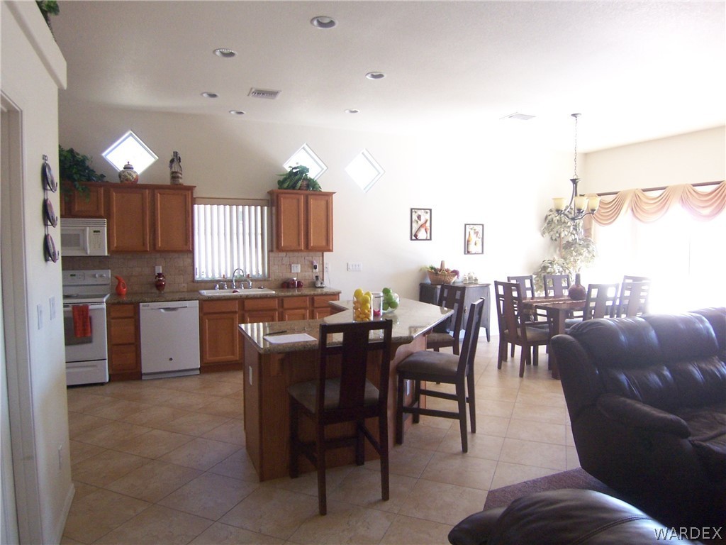 2340 Corwin Road Bullhead City, AZ 86442 - Photo 10 of 38 a view of a dining room kitchen and a window