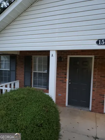 a view of a house with potted plants