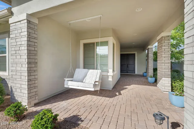 a kitchen with stainless steel appliances kitchen island a large island in the center and wooden floors