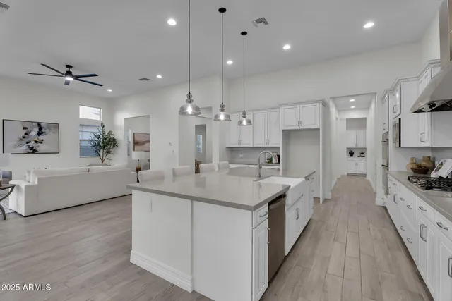 a spacious bedroom with a large bed and a large window