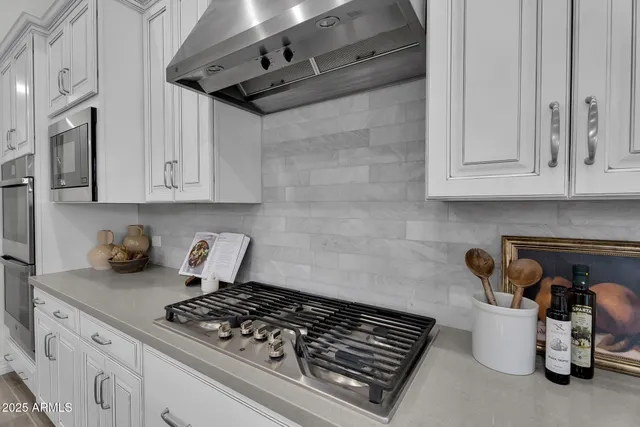 an aerial view of a house with a yard basket ball court and outdoor seating