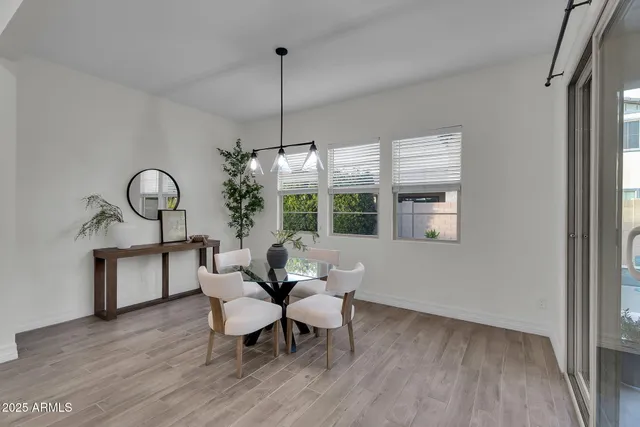 an aerial view of a house with a garden and lake view