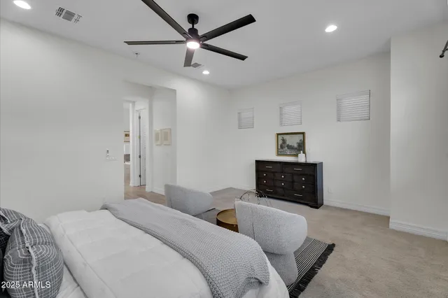 an aerial view of a house with a garden and mountain view
