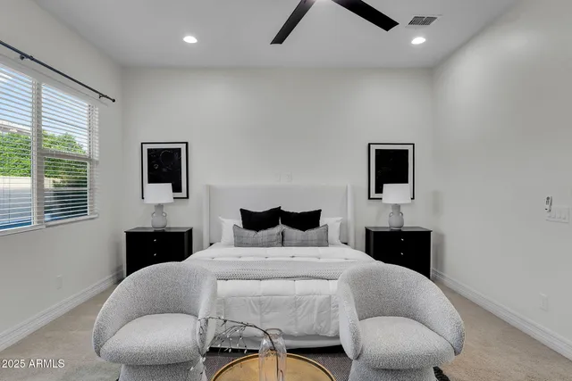 a view of house with a yard and potted plants