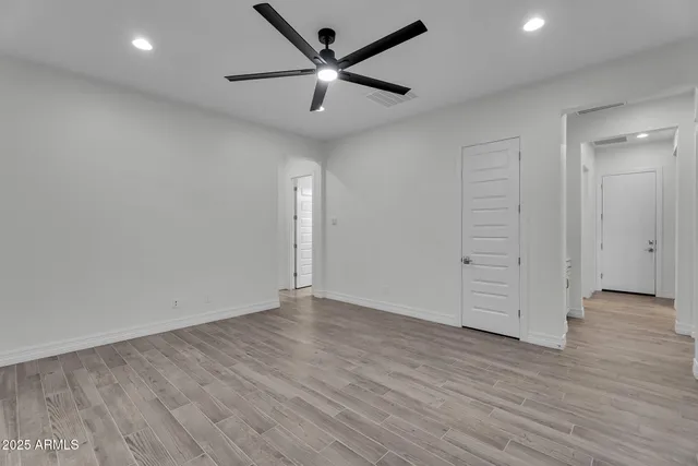 a view of a hall way with furniture