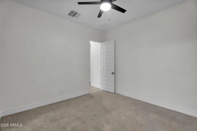 a view of a lake with houses in the back