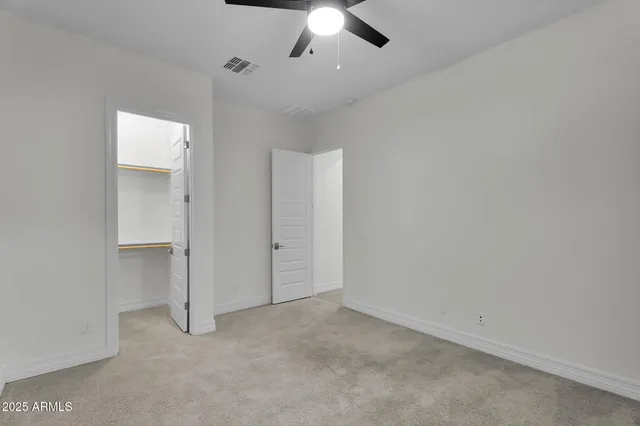 a view of a lake with houses in the background