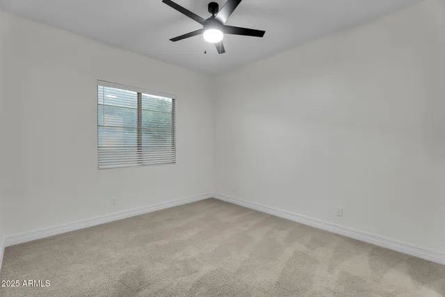 a view of a lake with houses in the back