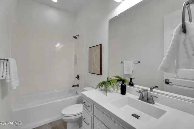 a view of a grassy field with an trees