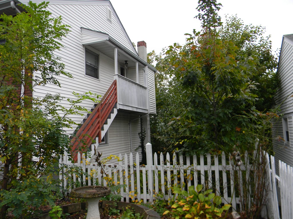 190 Ridge Road Revere, MA 02151 - Photo 3 of 13 a front view of a house with a garden