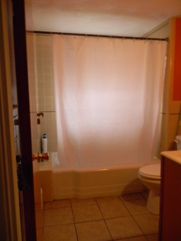 190 Ridge Road Revere, MA 02151 - Photo 10 of 13 a bathroom with a shower curtain