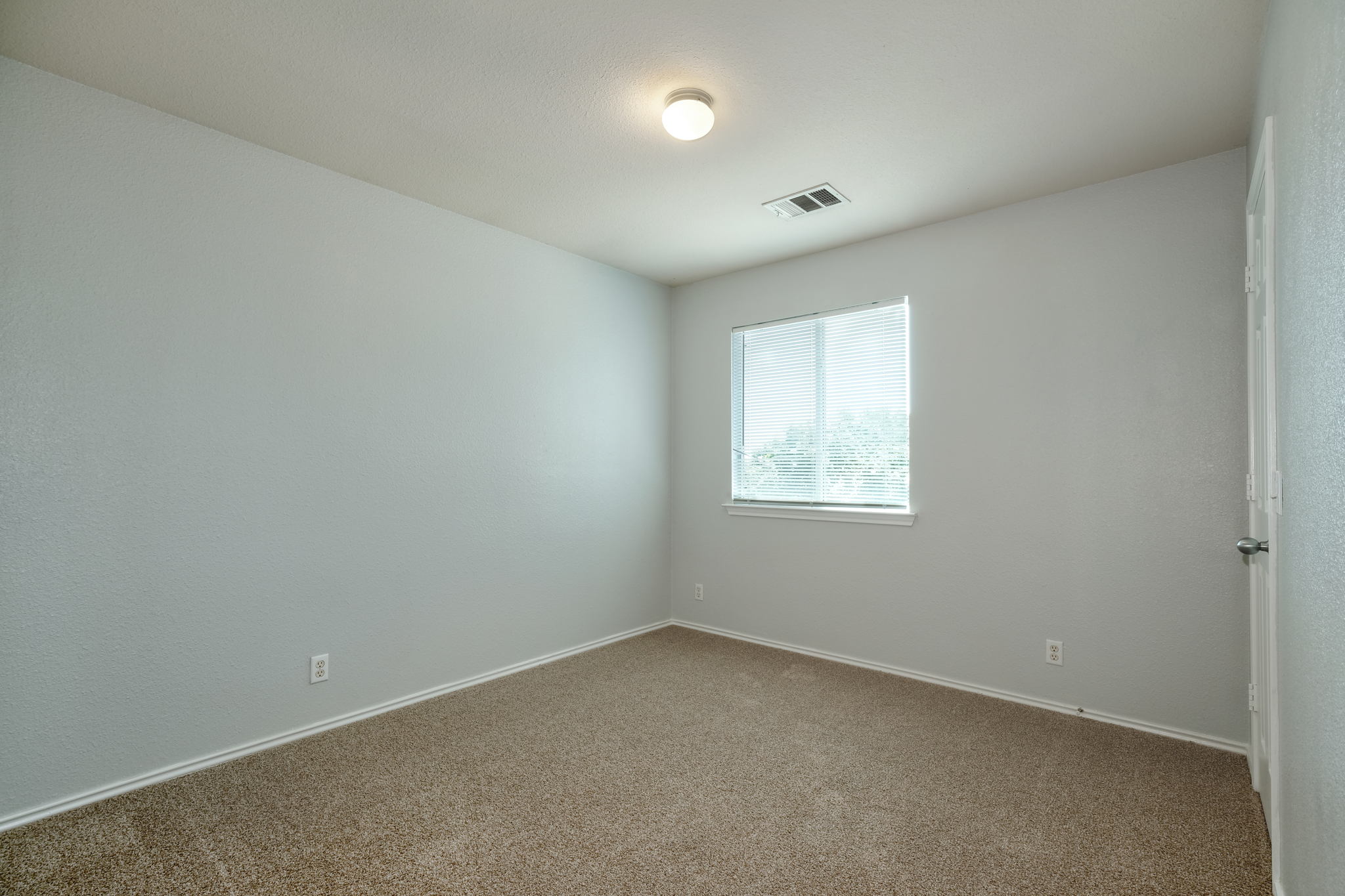 14312 Cummins Way Manor, TX 78653 - Photo 12 of 13 an empty room with a window
