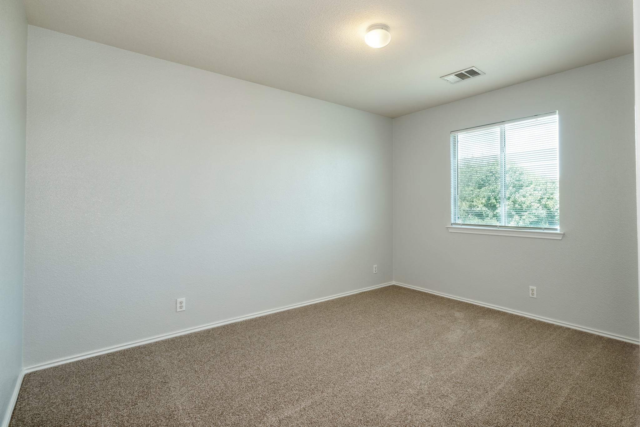 14312 Cummins Way Manor, TX 78653 - Photo 9 of 13 an empty room with a window