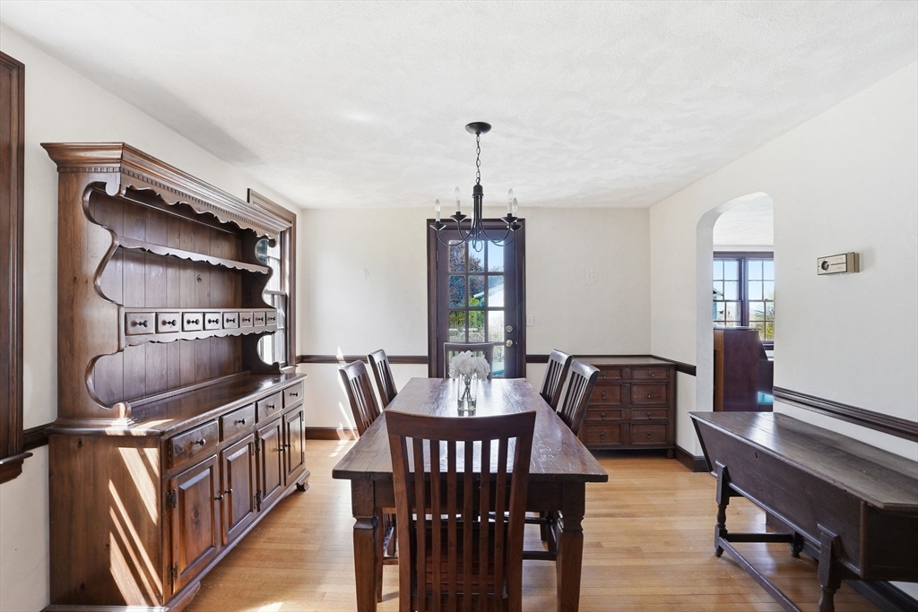 34 Governor Long Road Hingham, MA 02043 - Photo 5 of 37 a dining room with furniture a chandelier and wooden floor