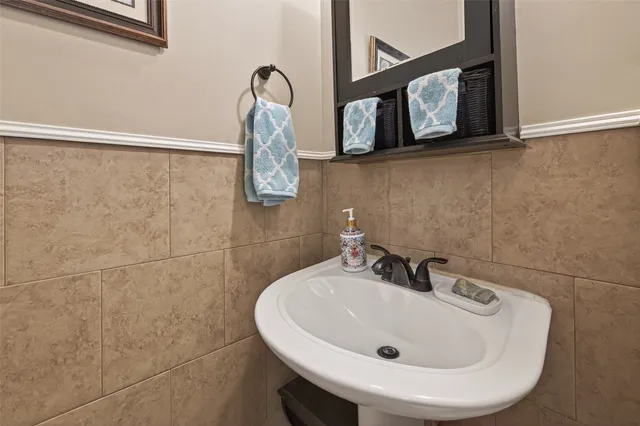a bathroom with a sink and mirror