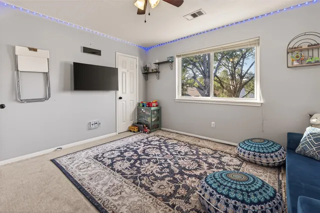 a bedroom with bed and a window