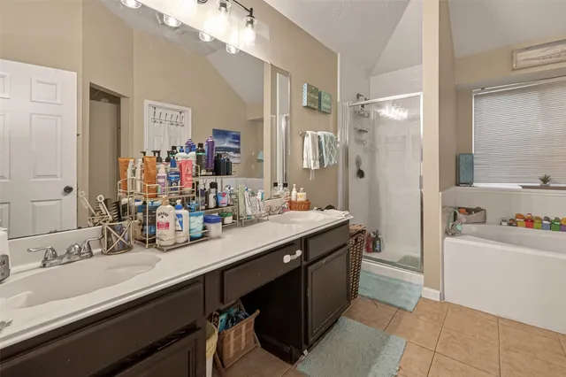 a bathroom with a sink double vanity and a mirror